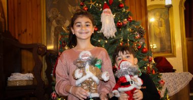 Kids hold Christmas decors at St. Corc Greek Orthodox Church in Iskenderun, Hatay, Türkiye, Dec. 12, 2023. (AA Photo)