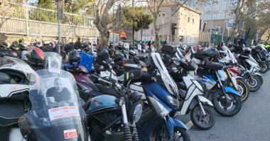Photos of Yunus Emre Göçer are displayed on motorcycles of couriers in protest of the deadly traffic incident, Istanbul, Türkiye, Dec. 11, 2023. (İHA Photo)
