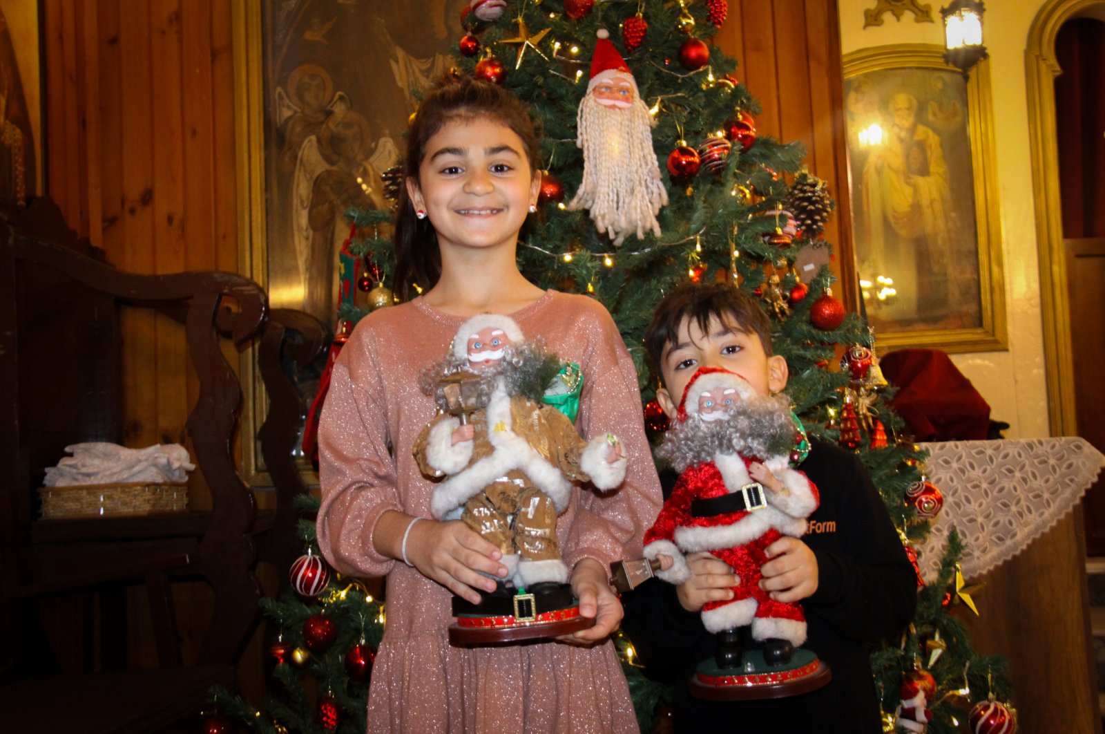 Kids hold Christmas decors at St. Corc Greek Orthodox Church in Iskenderun, Hatay, Türkiye, Dec. 12, 2023. (AA Photo)