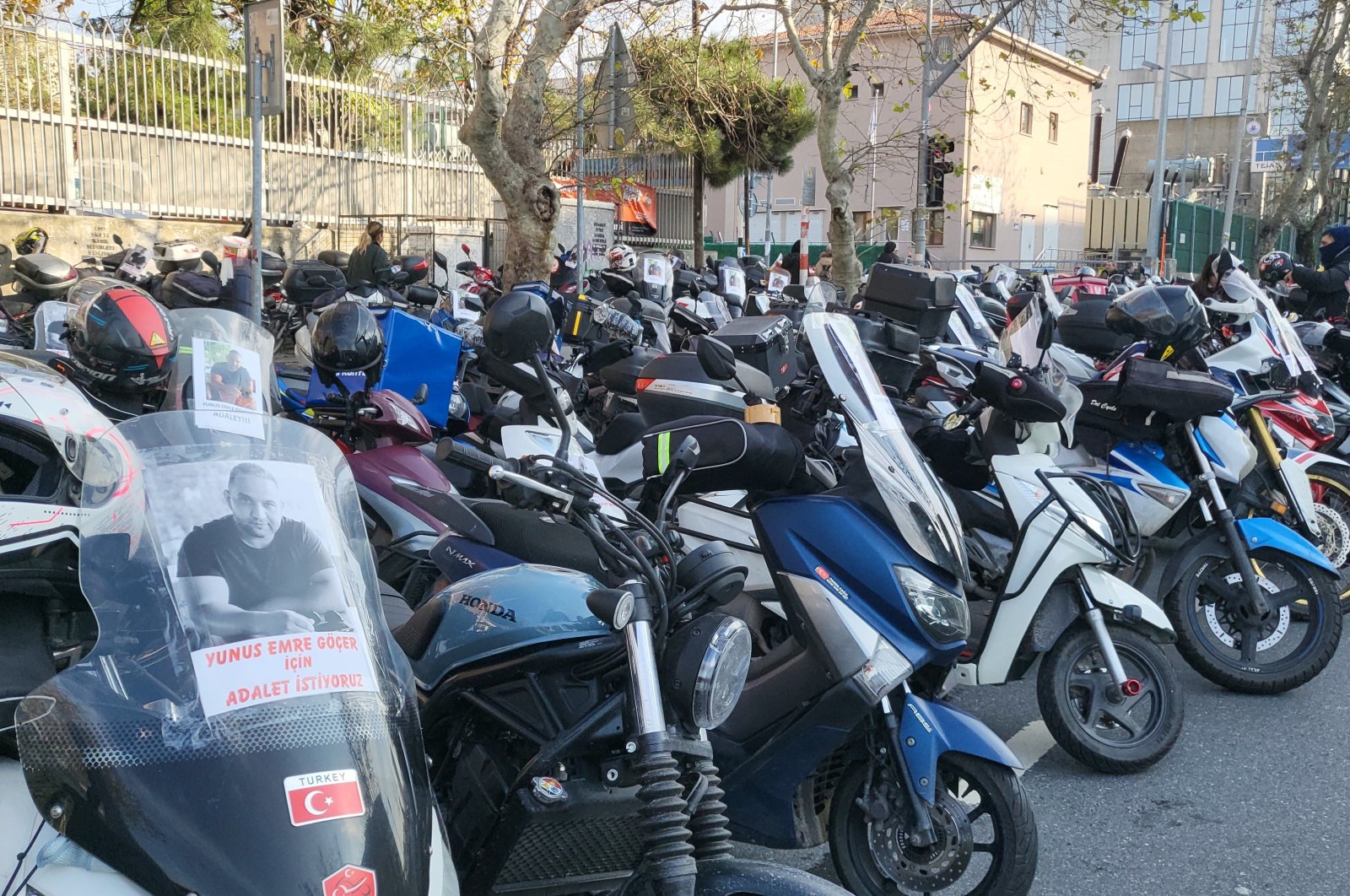 Photos of Yunus Emre Göçer are displayed on motorcycles of couriers in protest of the deadly traffic incident, Istanbul, Türkiye, Dec. 11, 2023. (İHA Photo)