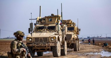 U.S. soldiers patrol an area on the outskirts of Rumaylan controlled by PKK/YPG terrorists, Syria, Dec. 12, 2023. (AFP Photo)