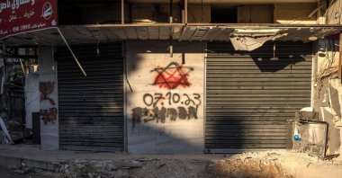 Red paint covers a Star of David with the date of Oct. 7, 2023 sprayed by Israeli soldiers on a wall in the Jenin refugee camp, occupied West Bank, Dec. 15, 2023. (AFP Photo)