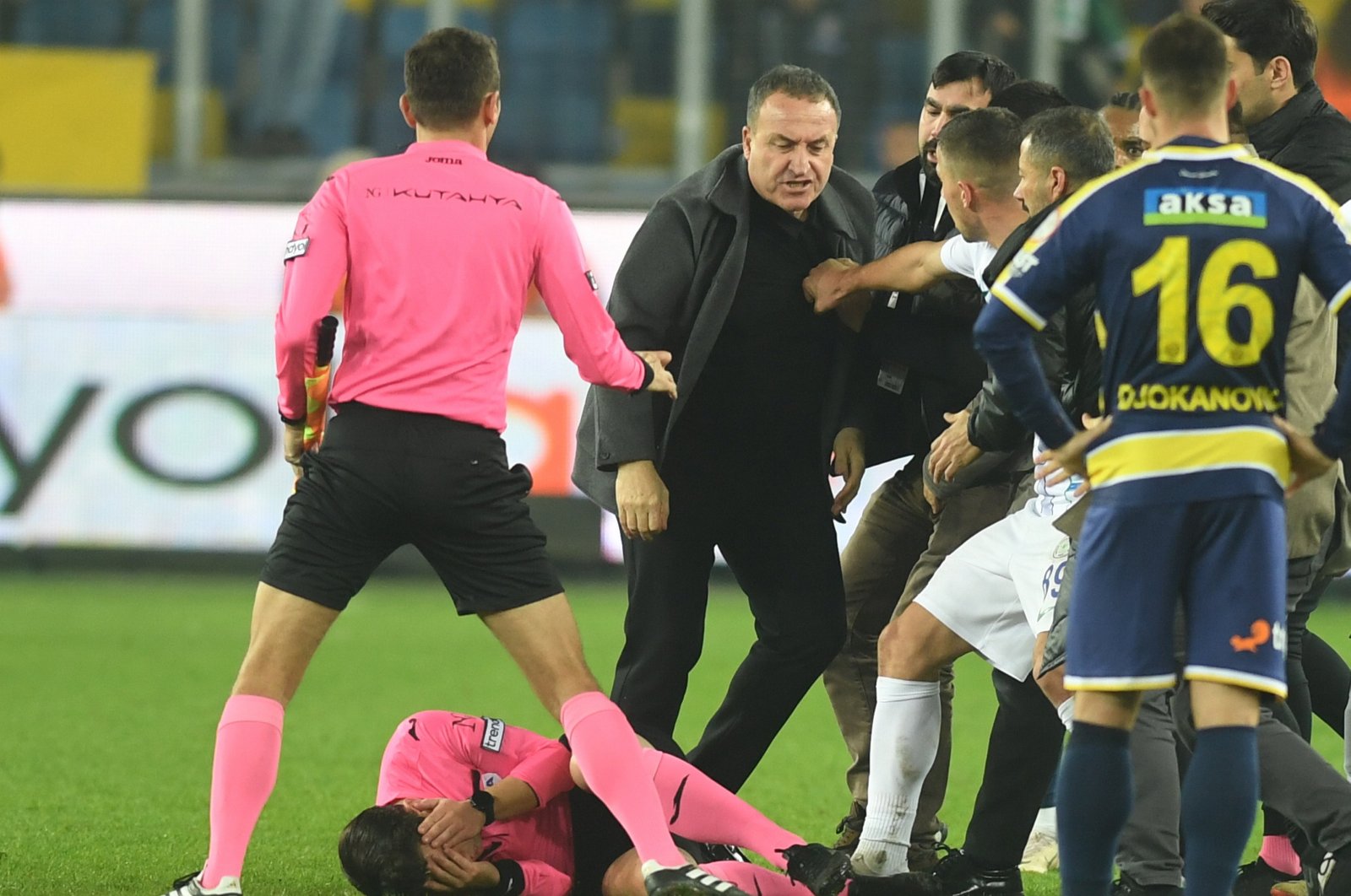 Turkish referee Halil Umut Meler is knocked to the ground after a punch thrown by Ankaragücü President Faruk Koca (3rd L) after the Turkish Süper Lig match, Ankara, Türkiye, Dec. 11, 2023. (EPA Photo)