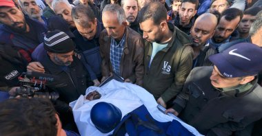 People mourn over the body of Al Jazeera cameraman Samer Abu Daqa, who was killed during Israeli bombardment, Khan Yunis, southern Gaza Strip, Palestine, Dec. 16, 2023. (AFP Photo)