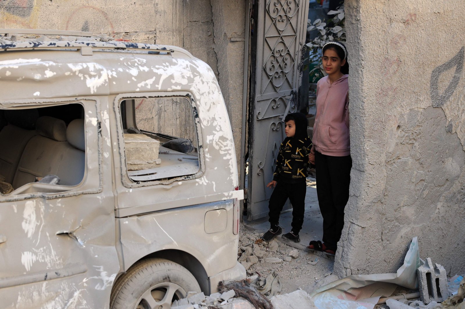 Palestinian children stare at the destruction following an early morning Israeli strike in Rafah in the southern Gaza Strip, Palestine, Dec. 9, 2023. (AFP Photo)