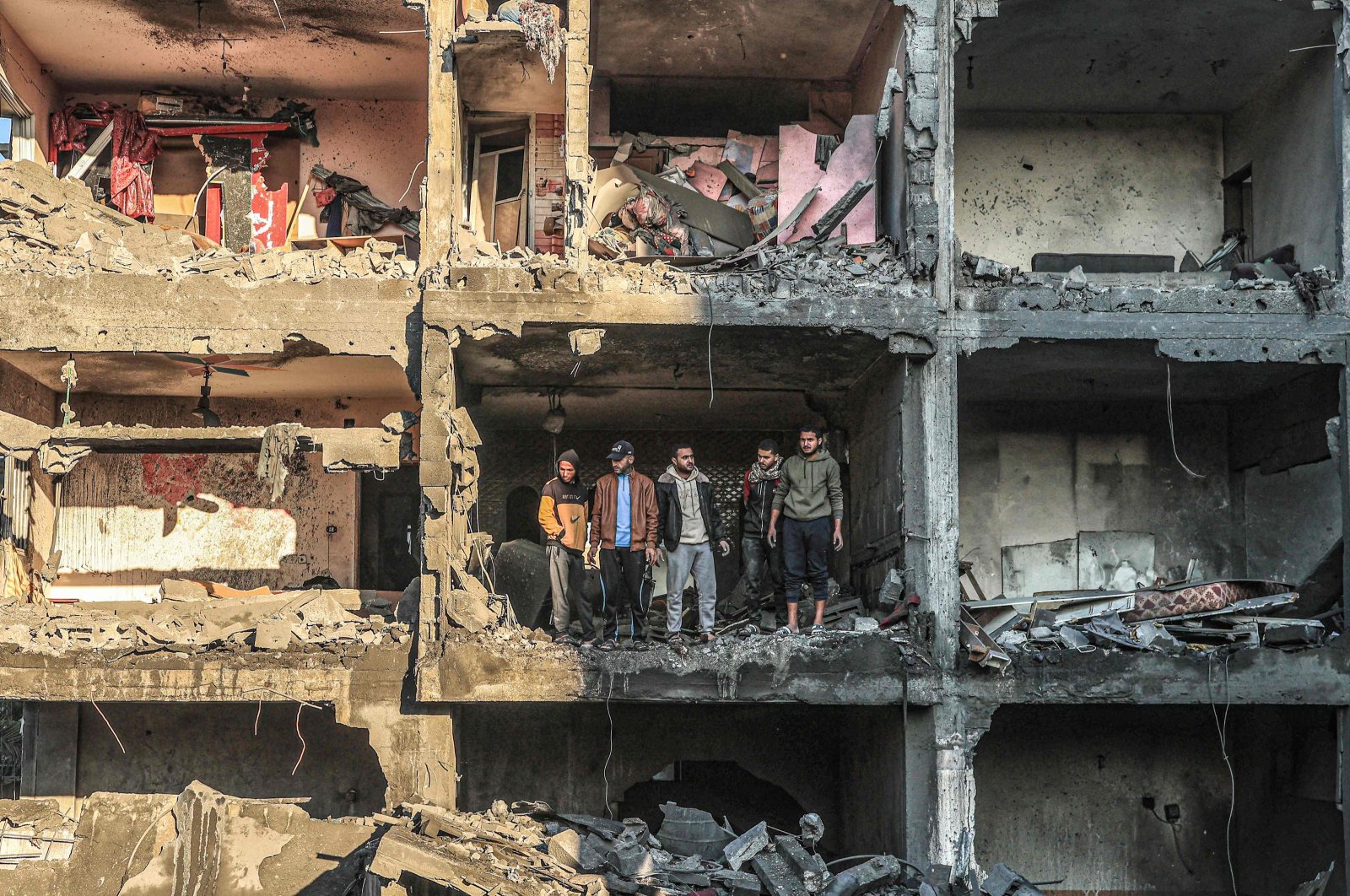 Palestinians check a half-destroyed building following Israeli bombardment on Rafah, southern Gaza Strip, Palestine, Dec. 15, 2023. (AFP Photo)