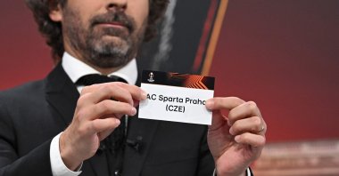 UEFA Europa League ambassador and former French football player, Julien Escude holds the paper slip of AC Sparta Praha during the UEFA Europa League knockout stage play-off draw at the House of European Football, Nyon, Switzerland, Dec. 18, 2023. (AFP Photo)