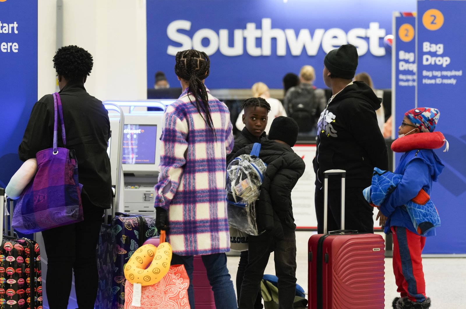 Travelers check in at Southwest Airlines at George Bush Intercontinental Airport, Houston, Texas, U.S., Nov. 21, 2023. (AP Photo)