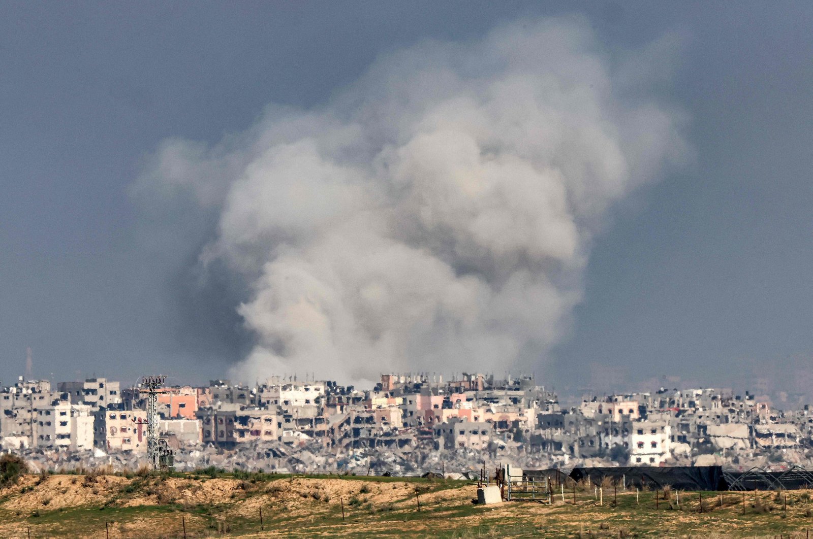 A smoke plume erupts during Israeli bombardment on the northern Gaza Strip, Palestine, Dec. 17, 2023. (AFP Photo)