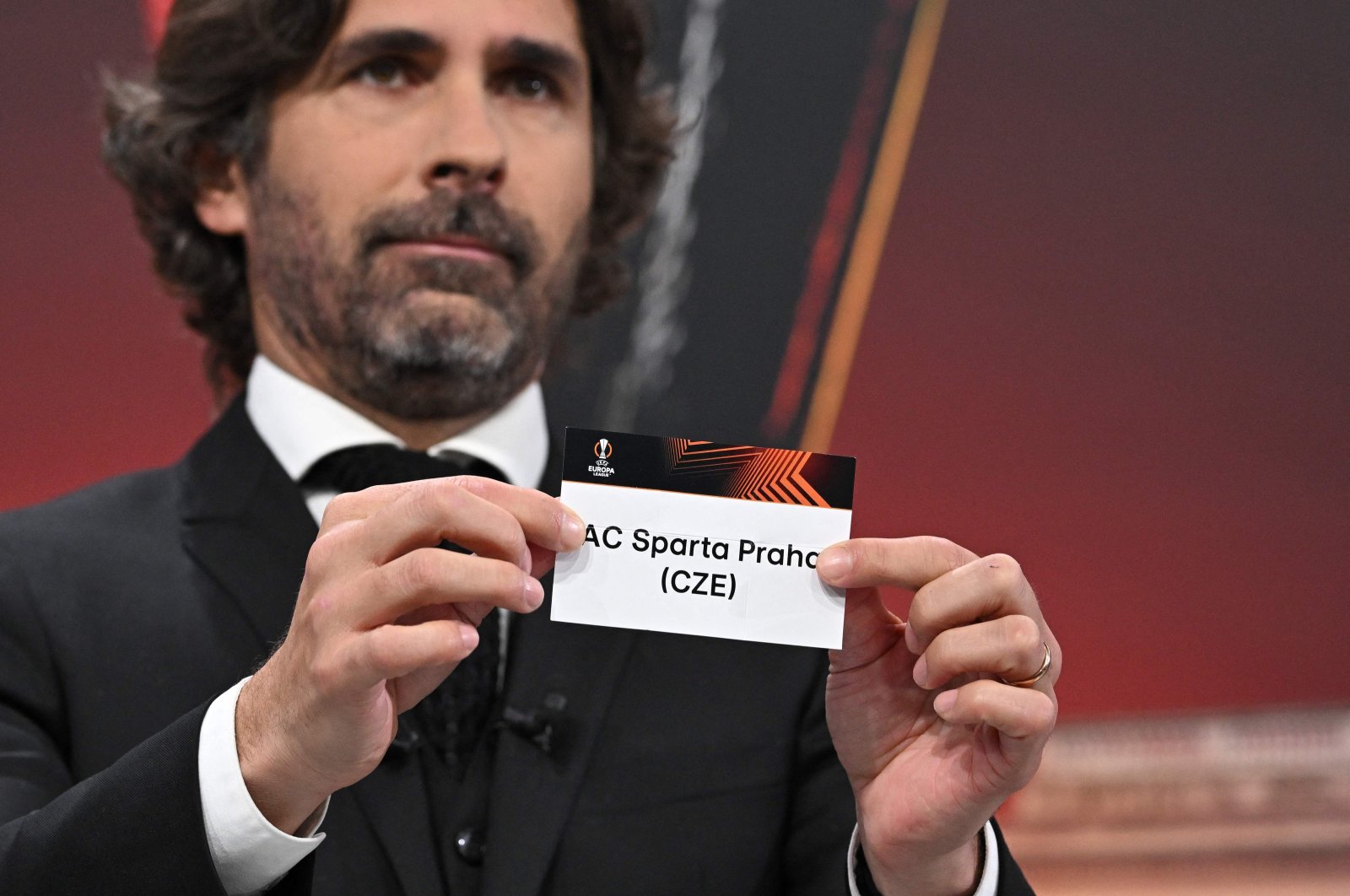 UEFA Europa League ambassador and former French football player, Julien Escude holds the paper slip of AC Sparta Praha during the UEFA Europa League knockout stage play-off draw at the House of European Football, Nyon, Switzerland, Dec. 18, 2023. (AFP Photo)