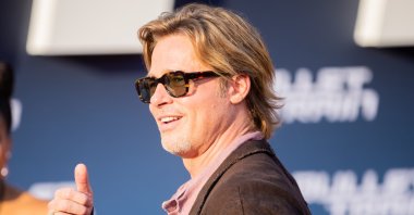 Brad Pitt gives a thumbs up as he arrives at the German premiere of the feature film "Bullet Train" at the Zoopalast, Berlin, Germany, July 19, 2022. (Getty Images Photo)