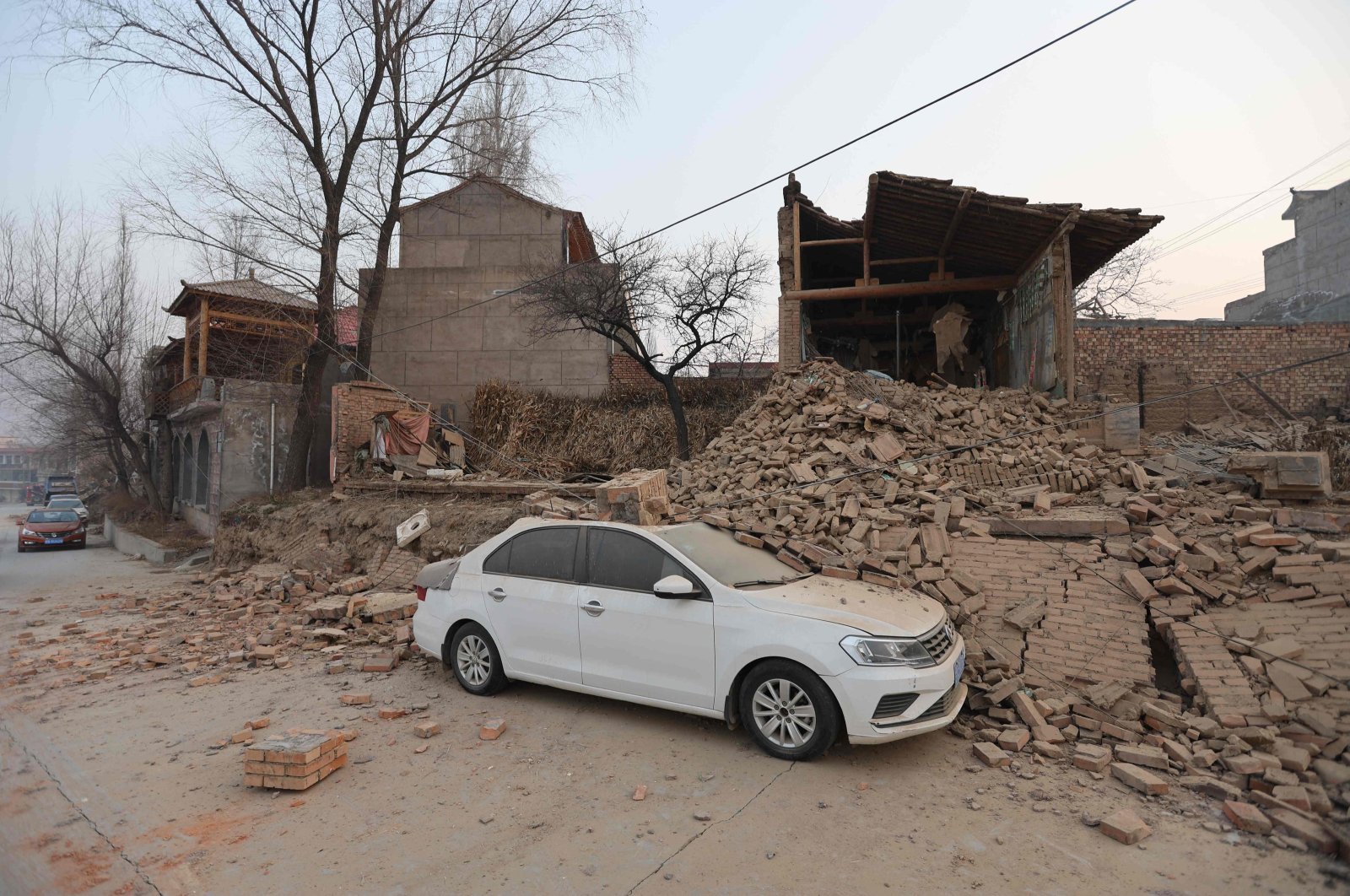 Collapsed buildings are seen after an earthquake in Dahejia, Jishishan county, Gansu province in northwest China, Dec. 19, 2023. (AFP Photo)