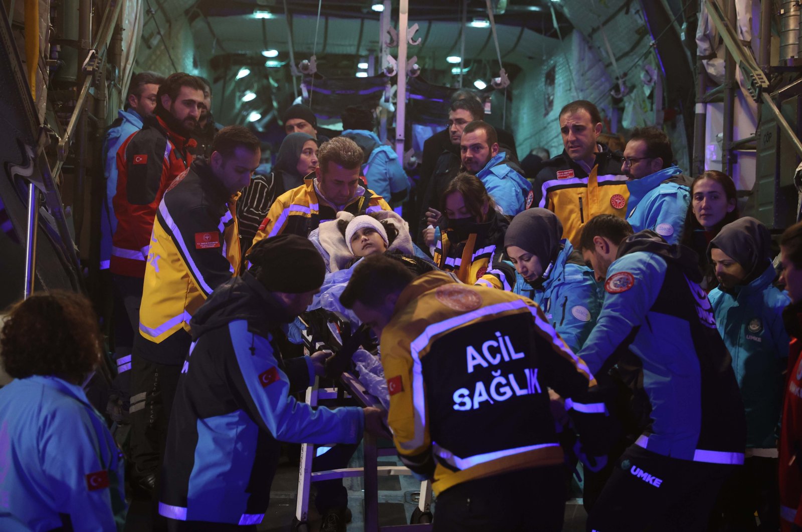 Patients disembark the plane in the company of health care personnel, in the capital Ankara, Türkiye, Dec. 18, 2023. (DHA Photo)