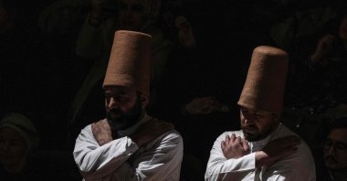 Whirling dervishes, wearing the symbolic hat &quot;sikke&quot;, perform the &quot;Sema&quot; ritual as part of a ceremony to celebrate the 750th anniversary of the death of Mevlana Jalaluddin Rumi, 13th-century Islamic poet, scholar, and Sufi mystic, at Mevlana Cultural Center in Konya, Türkiye, Dec. 17, 2023. (AFP Photo)