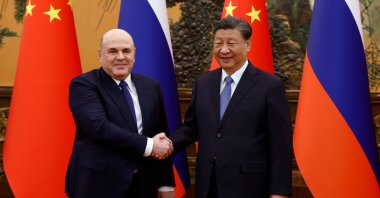 Russian PM Mikhail Mishustin (L) and Chinese President Xi Jinping shake hands in Beijing, China, Dec. 20, 2023. (EPA Photo)