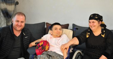 Süleyman Çahalov with his mother Gülsenem Çahalova and brother Mustafa Çahalov in Bursa, Türkiye, Dec. 21, 2023. (AA Photo)