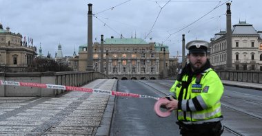 A police officer cordons off an area near the university in central Prague, on Dec. 21, 2023. (AFP Photo)