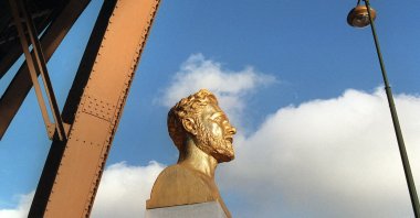 The picture shows the bust of Frenchman Gustav Eiffel near one pillar of his tower, Paris, France, Nov. 7, 2000. (AFP Photo)