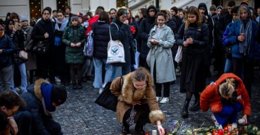 People pay their respects following a mass shooting at one building of the Charles University, in front of the university&#039;s main building in central Prague, Czech Republic, Dec. 22, 2023. (EPA Photo)
