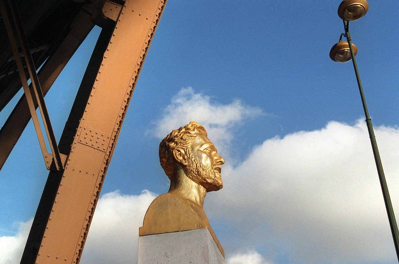 The picture shows the bust of Frenchman Gustav Eiffel near one pillar of his tower, Paris, France, Nov. 7, 2000. (AFP Photo)