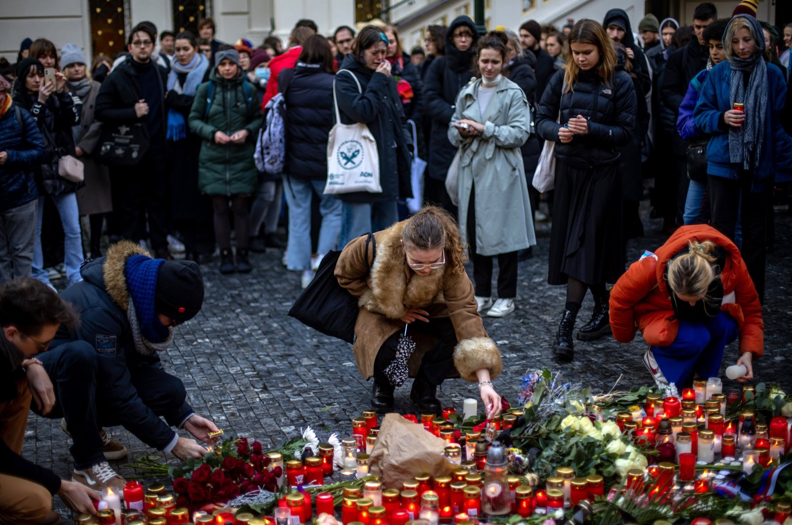 People pay their respects following a mass shooting at one building of the Charles University, in front of the university&#039;s main building in central Prague, Czech Republic, Dec. 22, 2023. (EPA Photo)