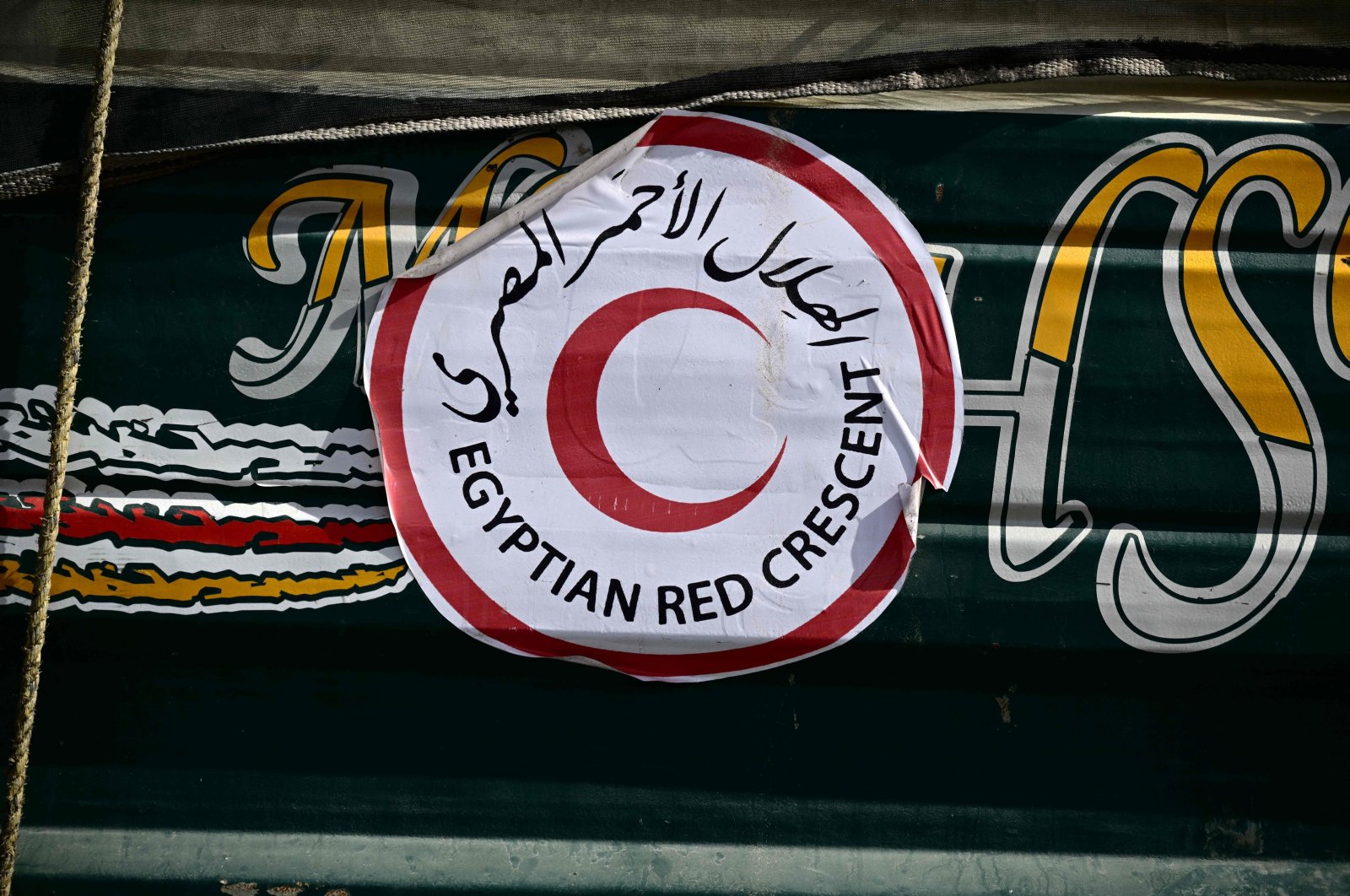 A picture shows an Egyptian Red Crescent sticker on a truck carrying humanitarian aid arriving from Egypt, on the Israeli side of the Kerem Shalom border crossing with the southern Gaza Strip on Dec. 22, 2023. (AFP Photo)