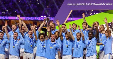 Manchester City players celebrate with their winning trophy at the end of the FIFA Club World Cup 2023 football final match against Brazil&#039;s Fluminense at King Abdullah Sports City Stadium, Jeddah, Saudi Arabia, Dec. 22, 2023. (AFP Photo)