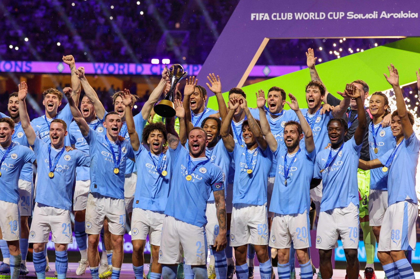 Manchester City players celebrate with their winning trophy at the end of the FIFA Club World Cup 2023 football final match against Brazil&#039;s Fluminense at King Abdullah Sports City Stadium, Jeddah, Saudi Arabia, Dec. 22, 2023. (AFP Photo)