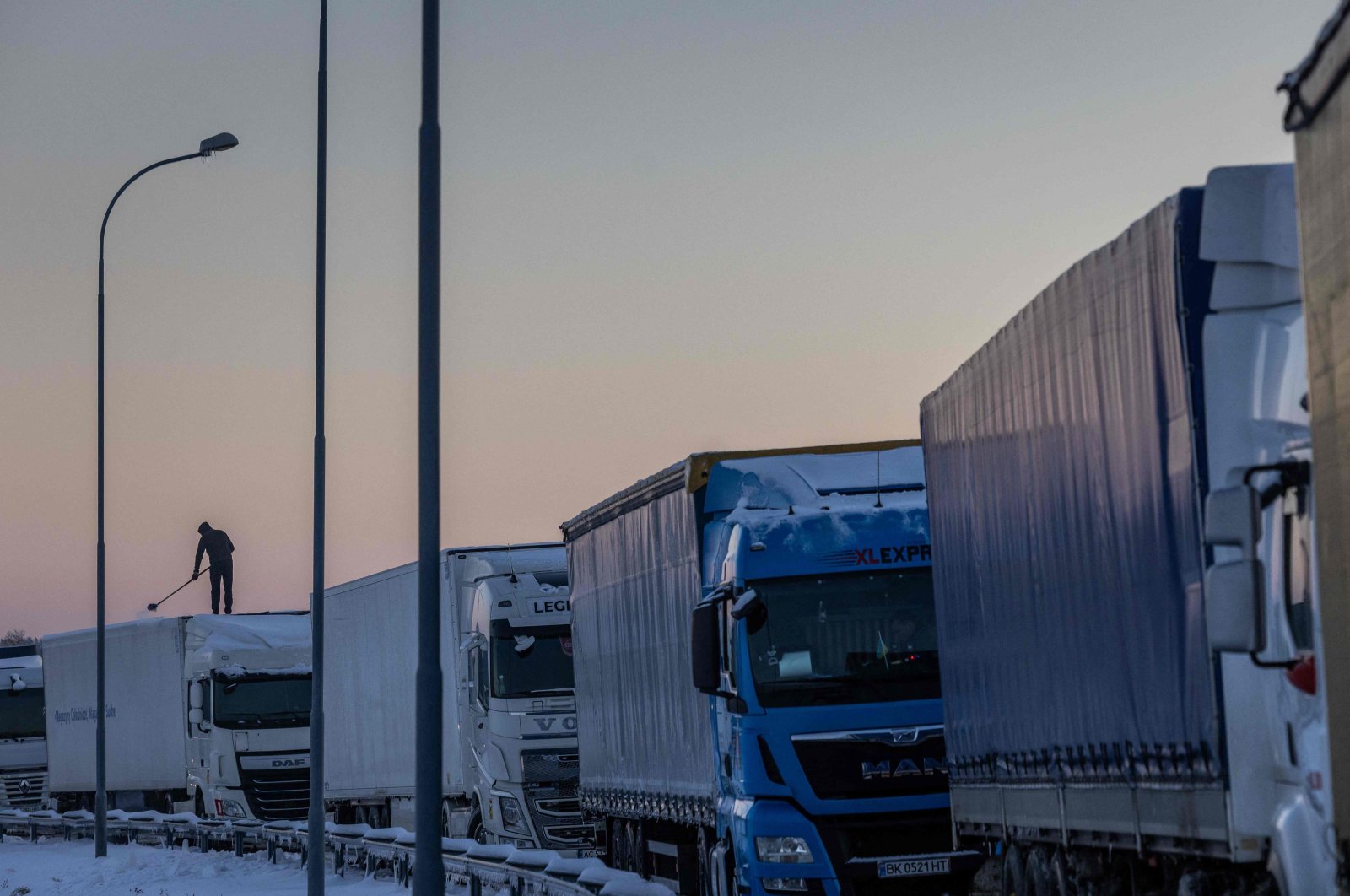 Trucks belonging to different Polish transport companies block access to the Polish-Ukraine border crossing in protest against &quot;unfair&quot; competition in Hrebenne, Poland, Dec. 4, 2023. (AFP Photo)