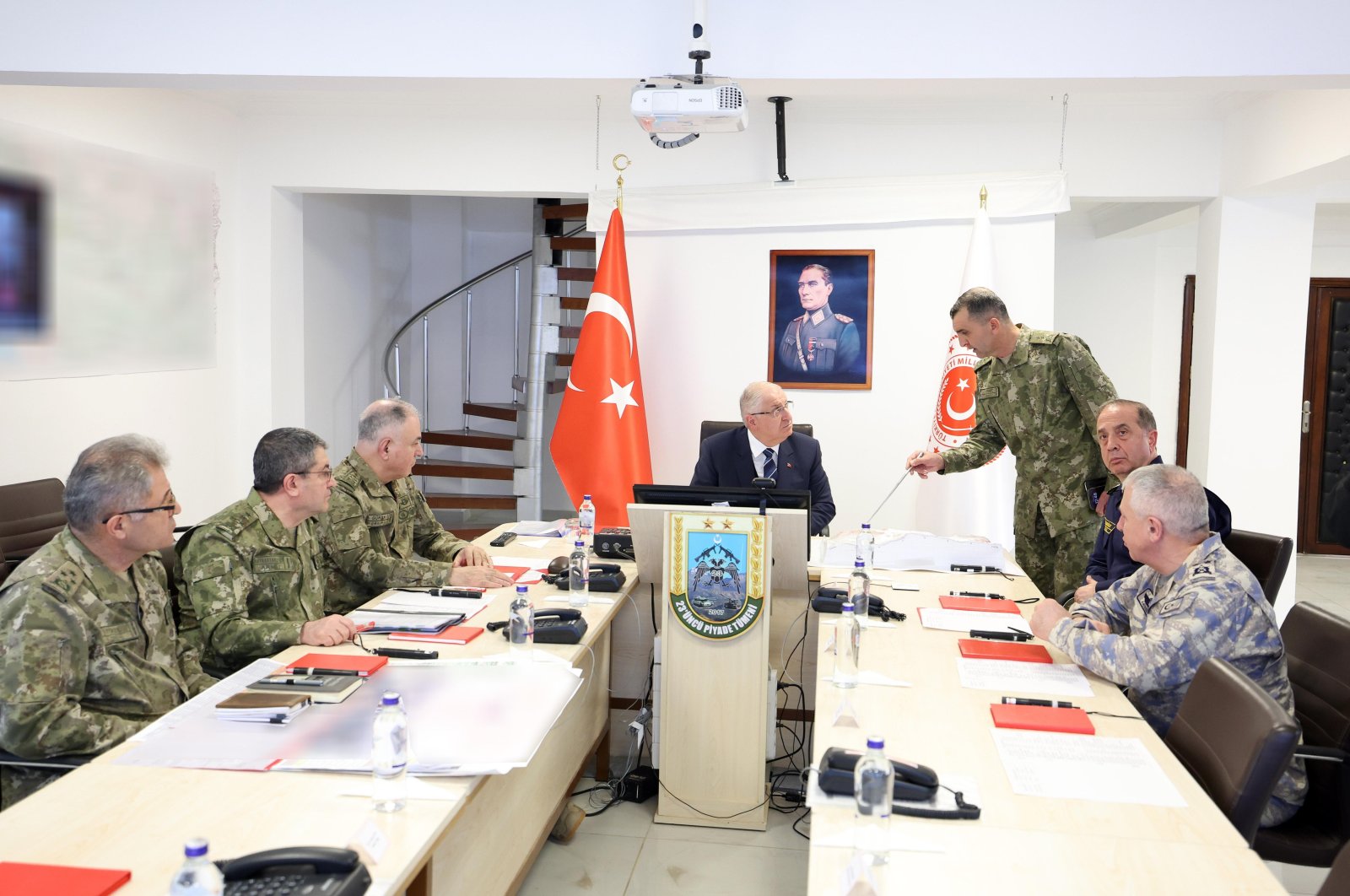 Defense Minister Yaşar Güler (C) attends a meeting with commanders at a military base, in Şırnak, southeastern TÜrkiye, Dec. 24, 2023. (IHA Photo)