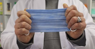 Pharmacist suggests mask usage amid surge in viral infection cases, Eskişehir, Türkiye, Dec. 25, 2023. (IHA Photo)