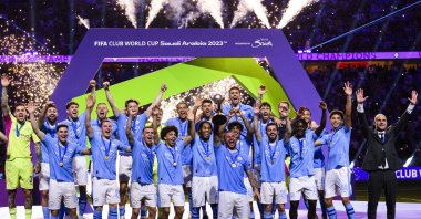 Manchester City squad celebrates with the FIFA Club World Cup trophy after beating Fluminense during the final at King Abdullah Sports City, Jeddah, Saudi Arabia, Dec. 22, 2023. (Getty Images Photo)