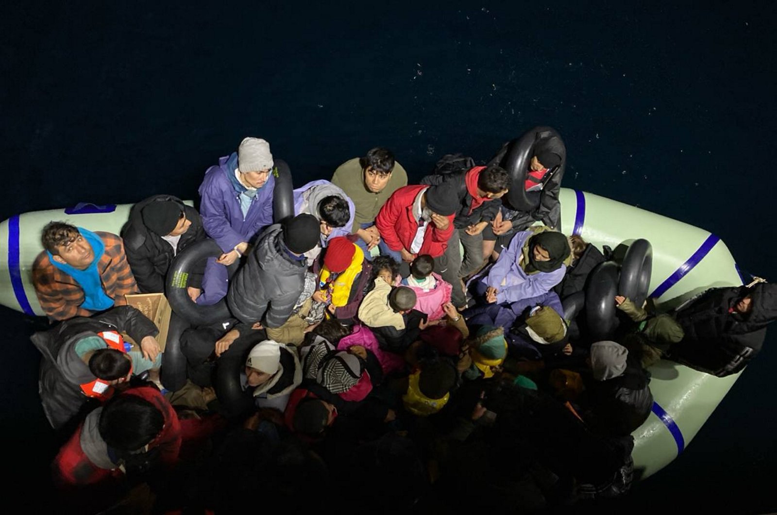 The Turkish coast guard helps 79 Afghan irregular migrants as were intercepted while traveling to Greece, in Çanakkale, western Türkiye, Dec. 22, 2023. (AA Photo)