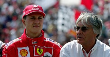 Ferrari driver Michael Schumacher (L) with Bernie Ecclestone before the Formula One Hungarian Grand Prix at the Hungaroring, Budapest, Hungary, Aug. 13, 2000. (Getty Images Photo)