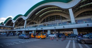 Passengers and vehicles are seen in front of the Sabiha Gökçen Airport, Istanbul, Türkiye, Dec. 12, 2023. (IHA Photo)