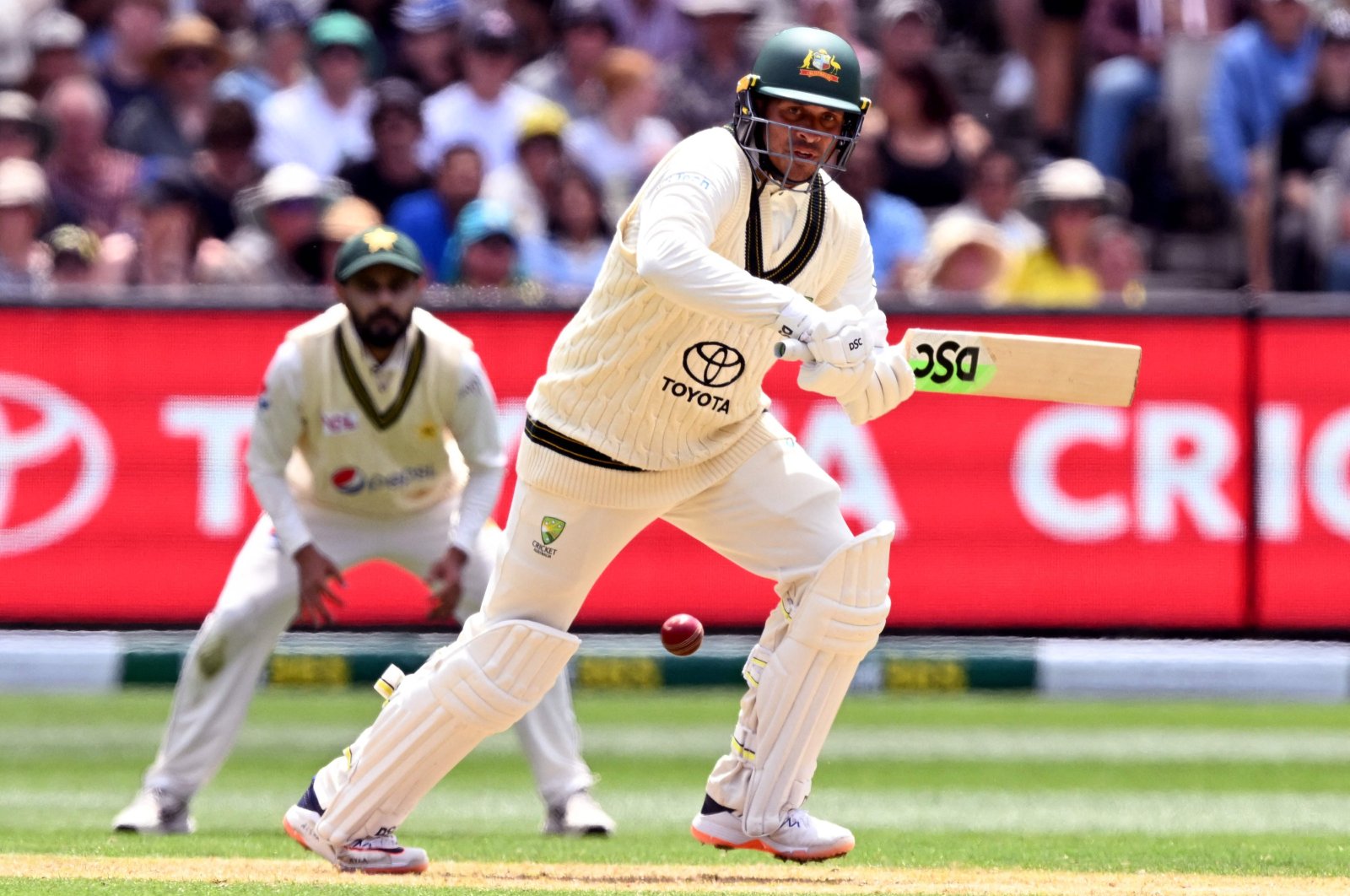 Australia&#039;s batsman Usman Khawaja plays a shot on the first day of the second cricket Test match between Australia and Pakistan at the Melbourne Cricket Ground (MCG), Melbourne, Australia, Dec. 26, 2023. (AFP Photo) 