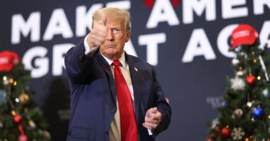 Republican presidential candidate and former U.S. President Donald Trump gestures at a campaign event, in Waterloo, Iowa, U.S, Dec. 19, 2023. (AFP Photo)
