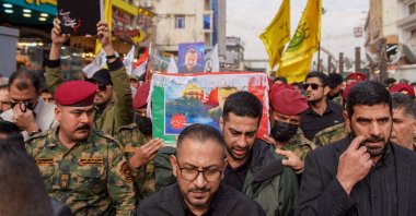 Honor guards carry the coffin of Razi Moussavi, a senior commander in the Quds Force of Iran's Islamic Revolutionary Guard Corps (IRGC) who was killed on Dec. 25 in an Israeli strike in Syria, during his funeral procession at the Imam Ali shrine in Iraq's holy city of Najaf, on Dec. 27, 2023. (AFP Photo)