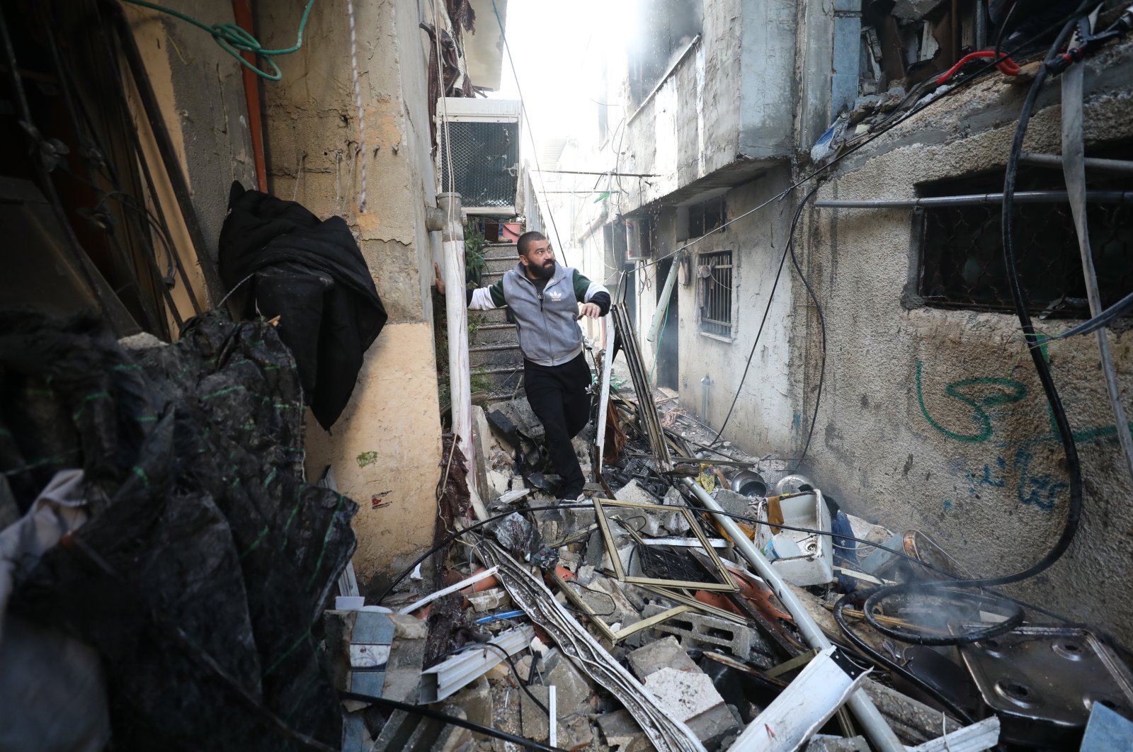 A resident inspects the damages following an Israeli army raid on Nour Shams refugee camp in Tulkarem, occupied West Bank, Palestine, Dec. 26, 2023. (EPA Photo)