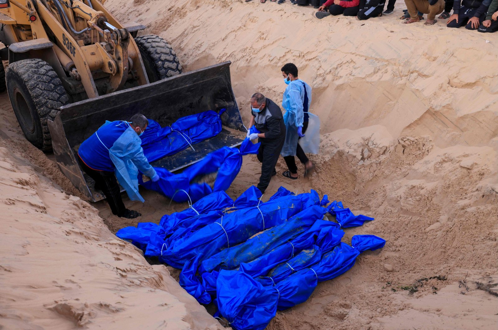 Bodies of Palestinians killed in northern Gaza, that were taken and later released by Israel, are buried in a mass grave in Rafah, southern Gaza Strip, Palestine, Dec. 26, 2023. (AFP Photo)