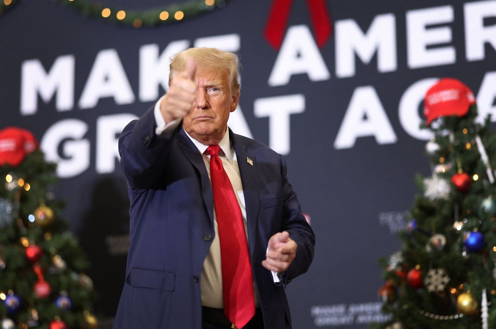 Republican presidential candidate and former U.S. President Donald Trump gestures at a campaign event, in Waterloo, Iowa, U.S, Dec. 19, 2023. (AFP Photo)