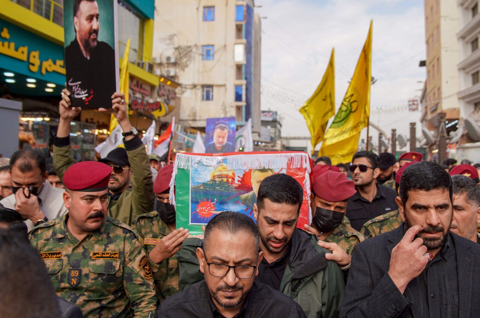 Honor guards carry the coffin of Razi Moussavi, a senior commander in the Quds Force of Iran&#039;s Islamic Revolutionary Guard Corps (IRGC) who was killed on Dec. 25 in an Israeli strike in Syria, during his funeral procession at the Imam Ali shrine in Iraq&#039;s holy city of Najaf, on Dec. 27, 2023. (AFP Photo)