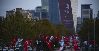 A poster of Mustafa Kemal Atatürk, the nation's founding leader, marking the 100 year anniversary of the modern Türkiye, is displayed on a commercial tower in Istanbul, Türkiye, Oct. 25, 2023. (AP Photo)