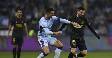 Ex PSG&#039; star Lionel Messi (R) and Cristiano Ronaldo of Riyadh XI fight for possession during the friendly match between Paris Saint-Germain and Riyadh XI at King Fahd International Stadium, Riyadh, Saudi Arabia, Jan. 19, 2023. (Getty Images Photo)