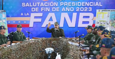 Venezuela's President Nicolas Maduro (C) delivers a speech next to Defense Minister Vladimir Padrino Lopez (L) during a meeting with members of the Bolivarian National Armed Forces (FANB) in Caracas, Venezuela, Dec. 28, 2023. (AFP Photo)