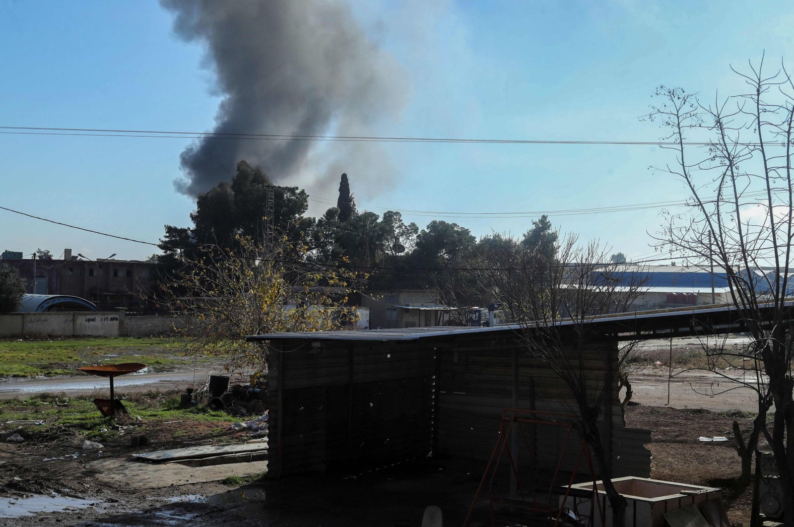 Smokes billows after Turkish airstrikes targeted the PKK, in Qamishli, Syria, Dec. 25, 2023. (AFP Photo)