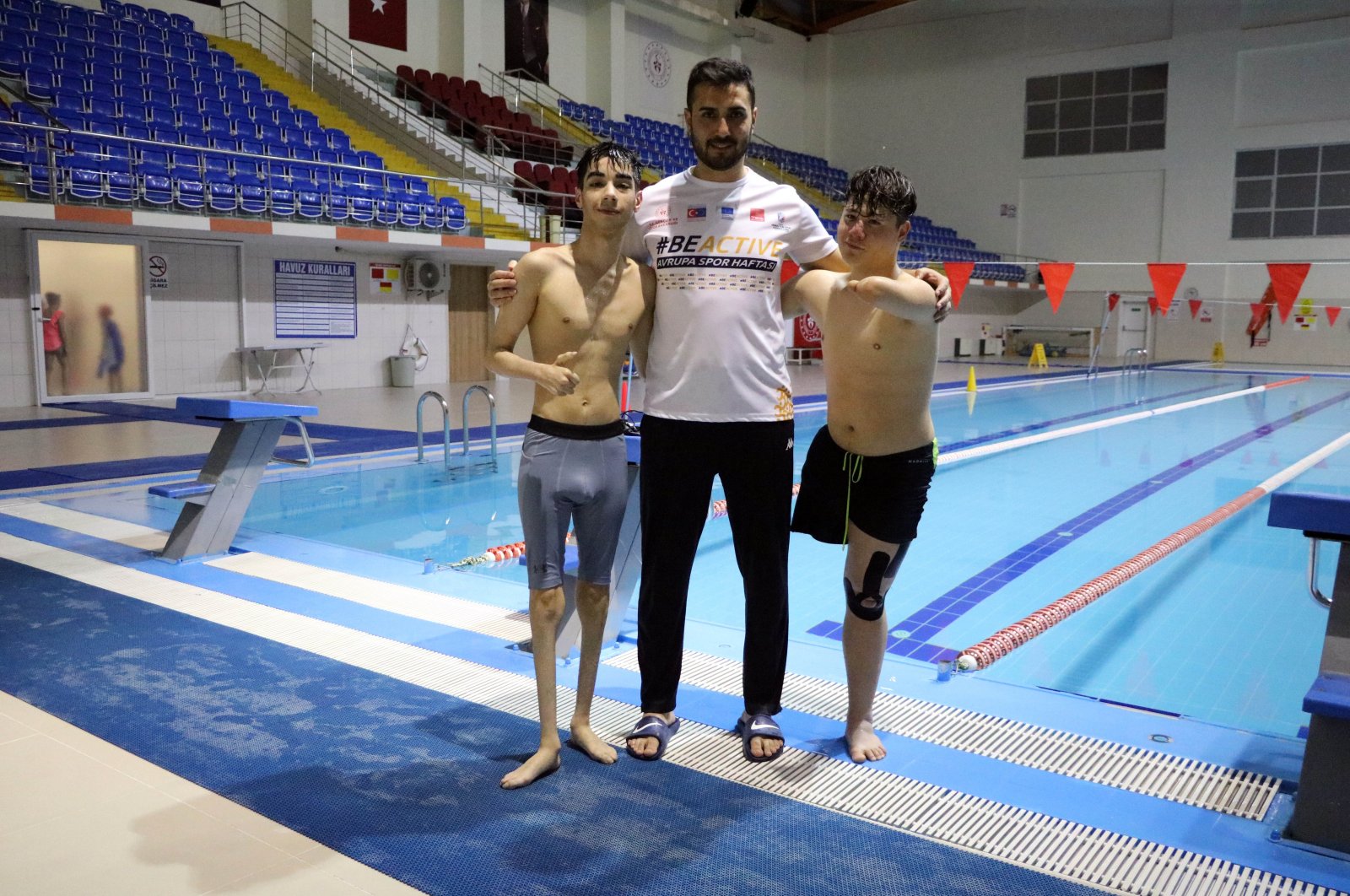 Turkish swimmers Muhammet Enes Sarı (R) and Süleyman Enes Mete Arslan (L) pose for a photo, Yozgat, Türkiye, Dec. 28, 2023. (IHA Photo)