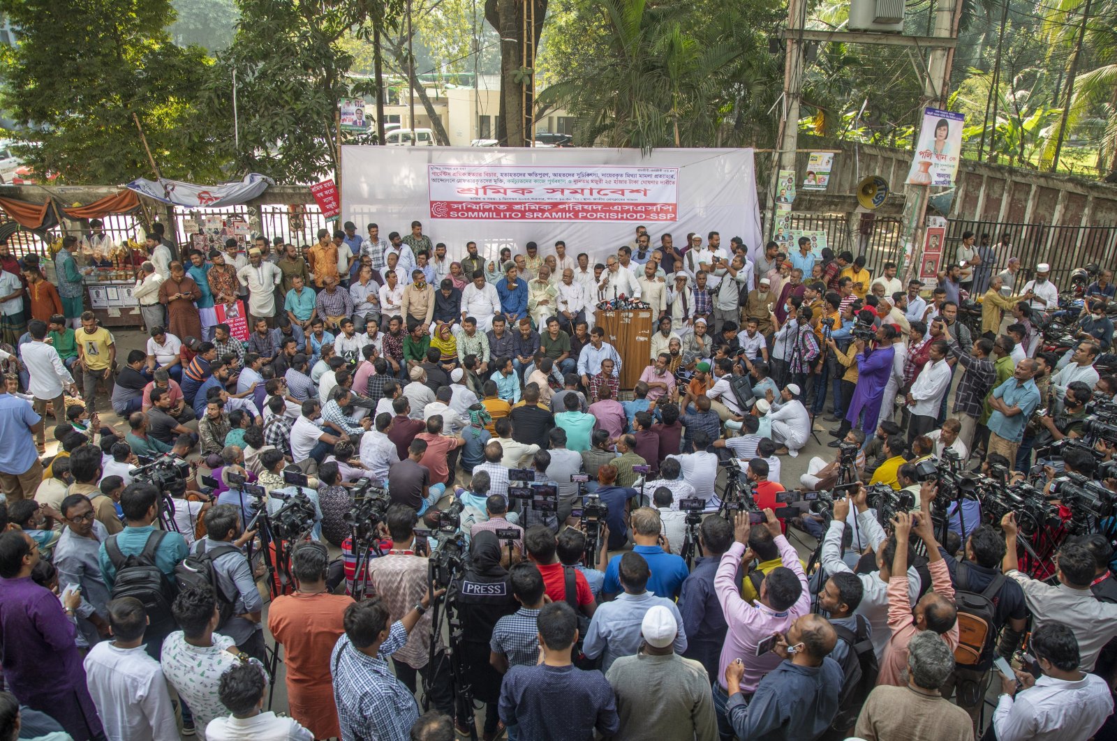 Garment workers&#039; union members hold placards and shout slogans as they take part in a protest to stress their six-point demand, including an increase in minimum wages, in front of the Press Club in Dhaka, Bangladesh, Dec. 1, 2023. (EPA Photo)