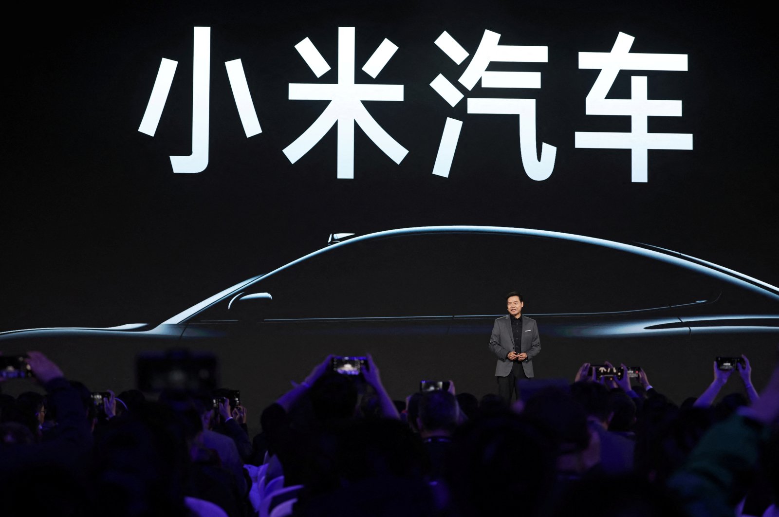 Xiaomi founder and CEO Lei Jun speaks at an event on the company&#039;s first electric vehicle (EV) SU7, in Beijing, China, Dec. 28, 2023. (Reuters Photo)