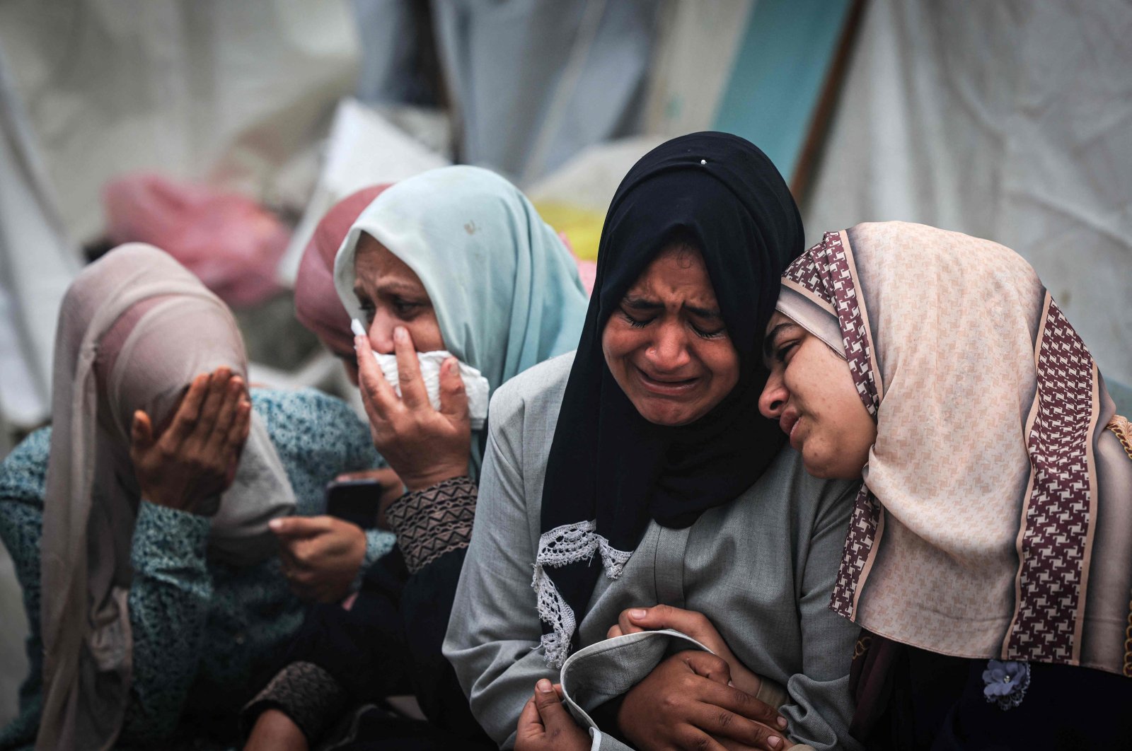 Palestinians mourn their relatives, killed by an overnight Israeli strike on the al-Maghazi refugee camp, during a mass funeral at the Al-Aqsa Hospital, Deir Al-Balah, southern Gaza Strip, Palestine, Dec. 25, 2023. (AFP File Photo)